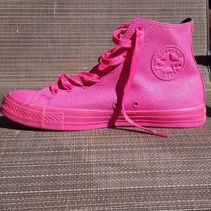 Pink leather converse.